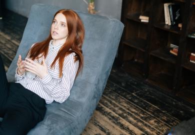 Young woman on psychotherapist's couch